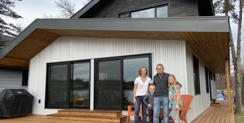 Happy family in front of their SIP home